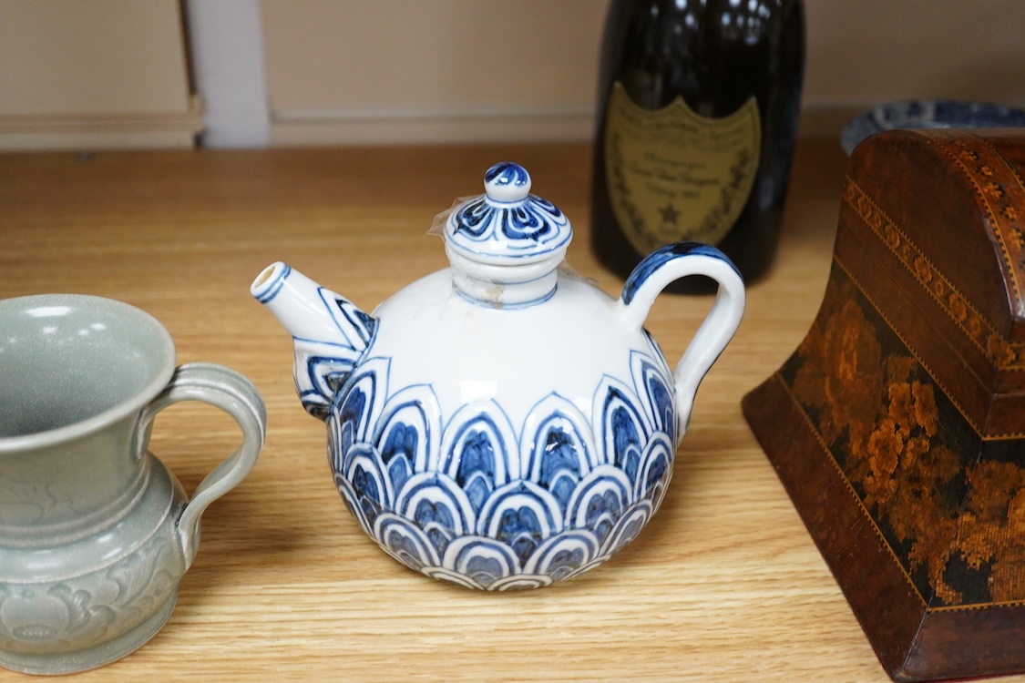 A Chinese blue and white teapot and cover, Xuande mark but later and a Chinese celadon glazed jug, tallest 13.5cm